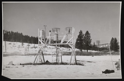 Snow monitoring station with shallow snow and worker, copy 1