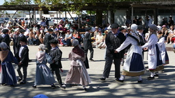 Young Basque dancers dancing in pairs in circle