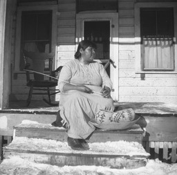 Washoe woman sitting on porch