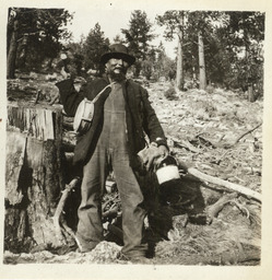 Paiute man by tree stump