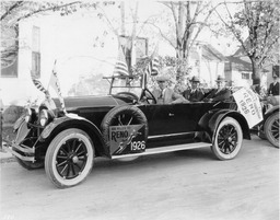 Men in an automobile advertising exposition, circa 1925