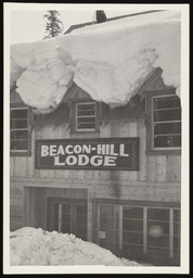 Beacon-Hill Lodge roof covered with a cornice of snow