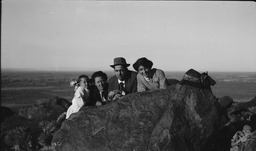 Man, two women, and child at Rattlesnake Hill by Fallon