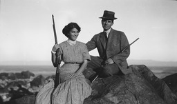 Couple with shotguns at Rattlesnake Hill, Fallon, Nevada