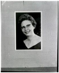 A portrait of a woman with glasses