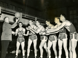 Glenn "Jake" Lawlor with six basketball players, University of Nevada, 1949