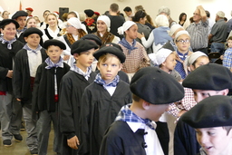 Young Basque dancers in procession after mass