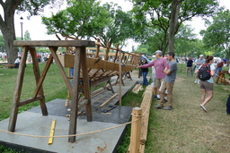 People inspect traineru (rowboat) shell