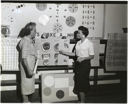 Two women with teaching materials