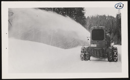 Snow blower tractor in use