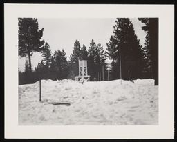 Thermometer station with snow poles and evaporation pan