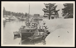 Mount Rose cabin cruiser docked at snowy bank, copy 1