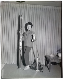 A woman modeling skis