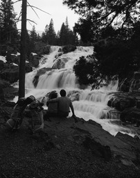 Backpackers at waterfall