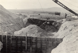 Excavating backfill from over culvert in Lahontan Emergency Pumping Plant Discharge ditch, Newlands Project
