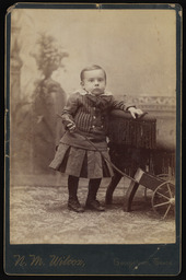 Charles Sparks with a toy wagon