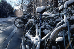 Winter on campus, bikes in snow, Frandsen Humanities, 2000