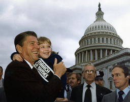 Photograph of Ronald Reagan holding Missy Jablonsky, Washington, D.C., 1980