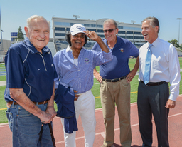 Johnny Mathis, with others, wearing University of Nevada, Reno cap