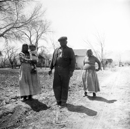 Man with two women and small child