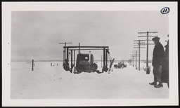 Snow removal equipment next to power lines