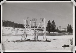 Snow monitoring station with shallow snow and worker, copy 3