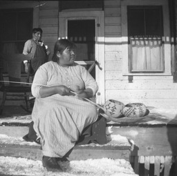 Washoe woman with baskets