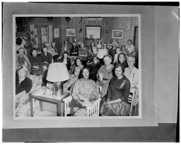Large group of women in a living room