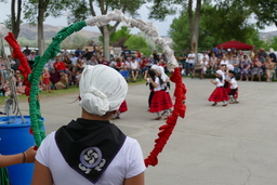 Young dancers seen through hoop at 2021 Basque Festival in Elko