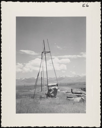Worker constructing tripod for windmill, copy 2