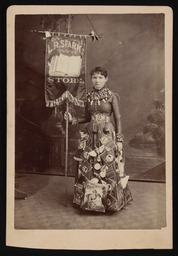 Woman in a trade costume for L. R. Sparks Store
