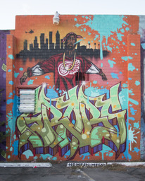 Unknown [Skyline, Tupac Shakur, Graffiti-Style Text]
