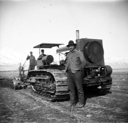 Three men with a tractor