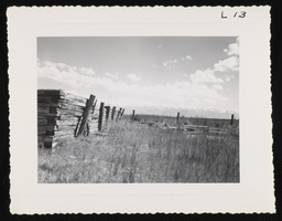 Wooden fence in dry grass valley, copy 2