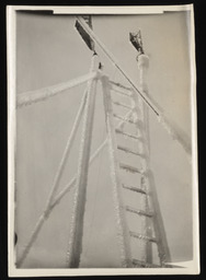 Snow station ladder covered in ice