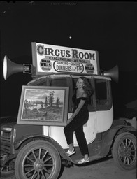 Woman holding a painting at the Circus Room Casino on the south shore of Lake Tahoe