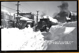 Trucks pulling out of Truckee, California, circa 1930s