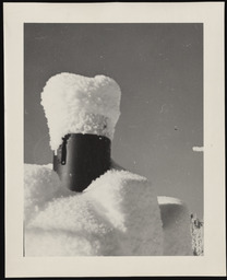 Cylindrical gauge covered with mound of snow, copy 1