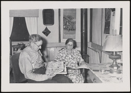 Relatives of Dr. Church reading newspapers