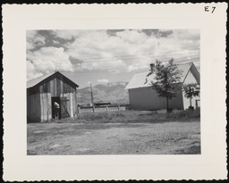 Worker with farm buildings, copy 1