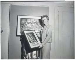 A woman displaying artworks