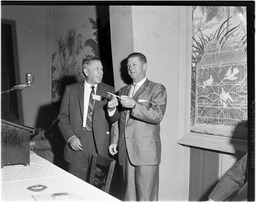 Bud Baker (right) presenting ceremonial key