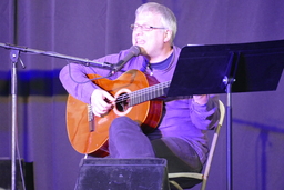 Markez playing guitar and singing