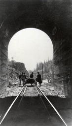 Men with speeder outside of tunnel (ca. 1914)
