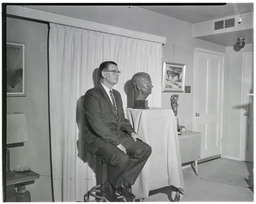 Dr. Charles J. Armstrong next to his bust sculpted by Jolande Jacobson, 2