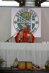 Priest giving Eucharistic prayer at Basque mass