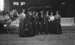 Group of women posed in front of Baker & Hamilton