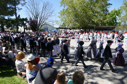 Marching band and young Basque dancers in procession