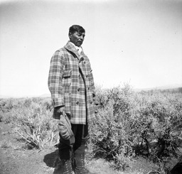 Washo man standing in desert