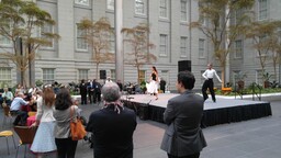 Attendees watching performance during Opening Ceremony 2